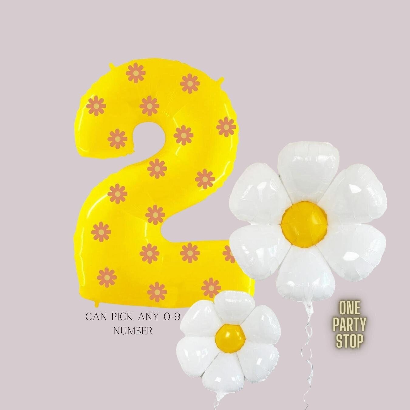 Yellow Nb 2, covered in daisy stickers + 2 daisy flower balloons.